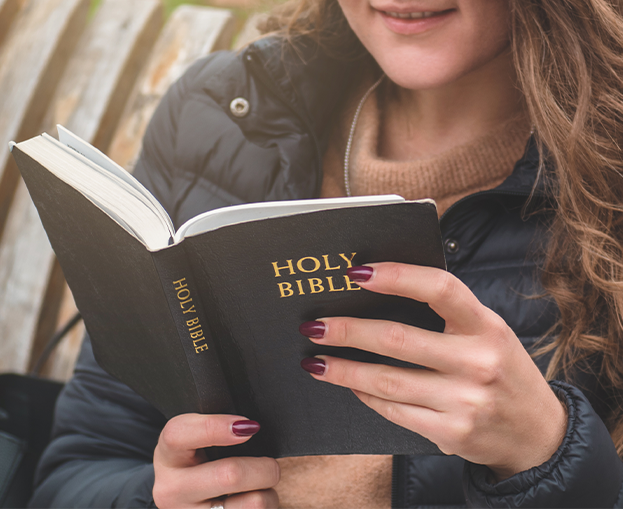 A woman studying the Bible deeply